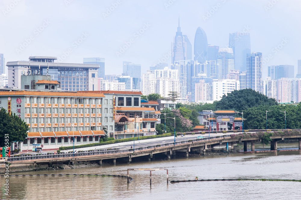 GUANGZHOU, CHINA - Oct.7: Day view of buildings by the Pearl River. The modern buildings on both sides of the Pearl River make it a beautiful landscape of the city. GUANGZHOU, CHINA - Oct.7: Day view of buildings by the Pearl River. The modern buildings on both sides of the Pearl River make it a beautiful landscape of the city.
