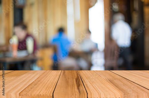 Wallpaper Mural Selected focus empty brown wooden table and Coffee shop blur bac Torontodigital.ca
