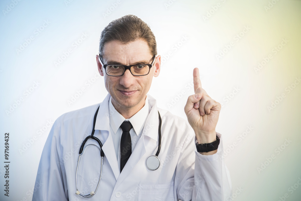 doctor standing with stethoscope shows the gesture of attention doctor standing with stethoscope shows the gesture of attention