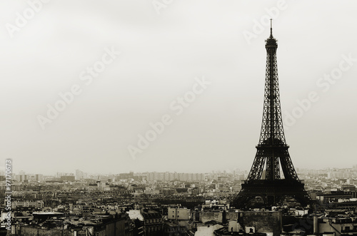 Eiffel tower and Paris roofs in black and white