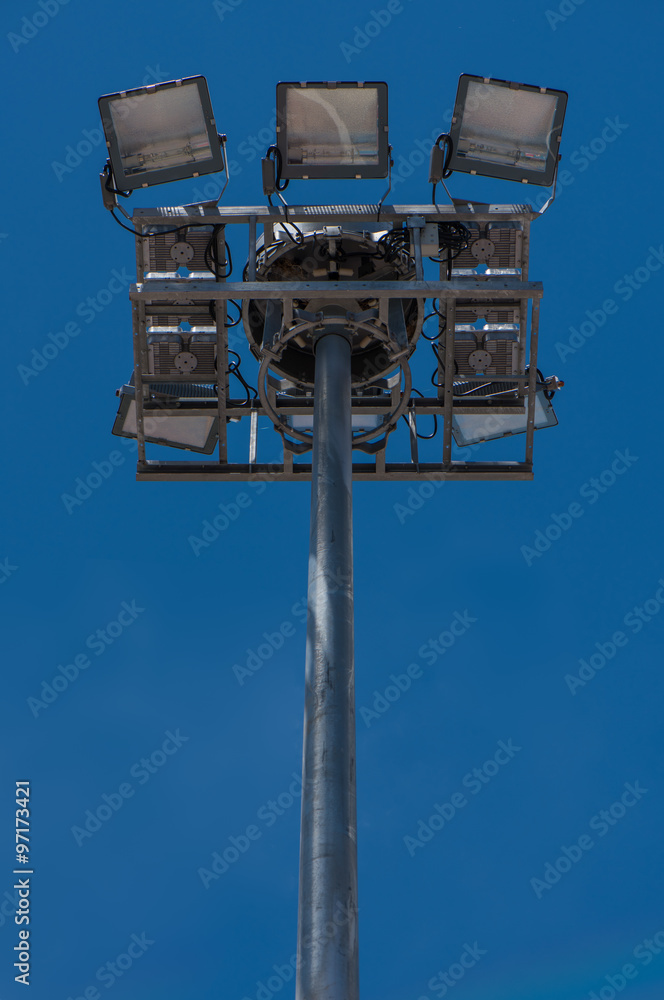 Stadium lights with blue sky background Stadium lights with blue sky background