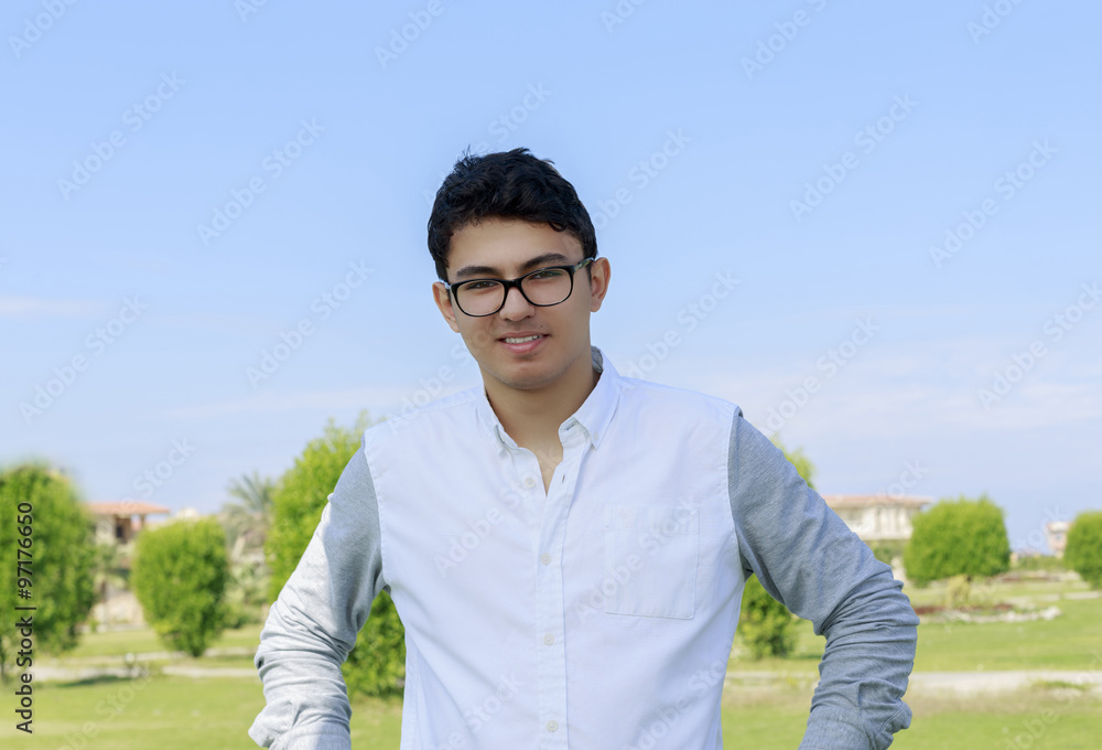 Young handsome teenager with great smile wearingn eyeglasses. Young handsome teenager with great smile wearingn eyeglasses.