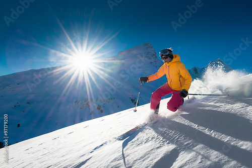 Girl telemark skiing snow slope in mountains photo