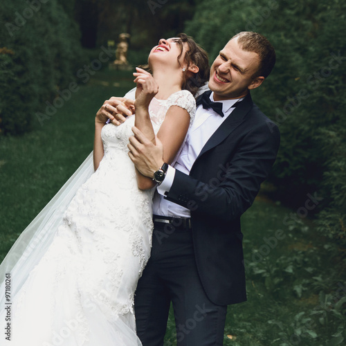 gorgeous elegant luxury bride and stylish groom running and havi photo