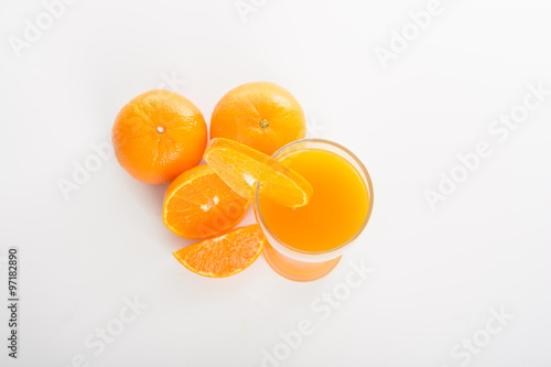 Orange juice in glass and slices orange