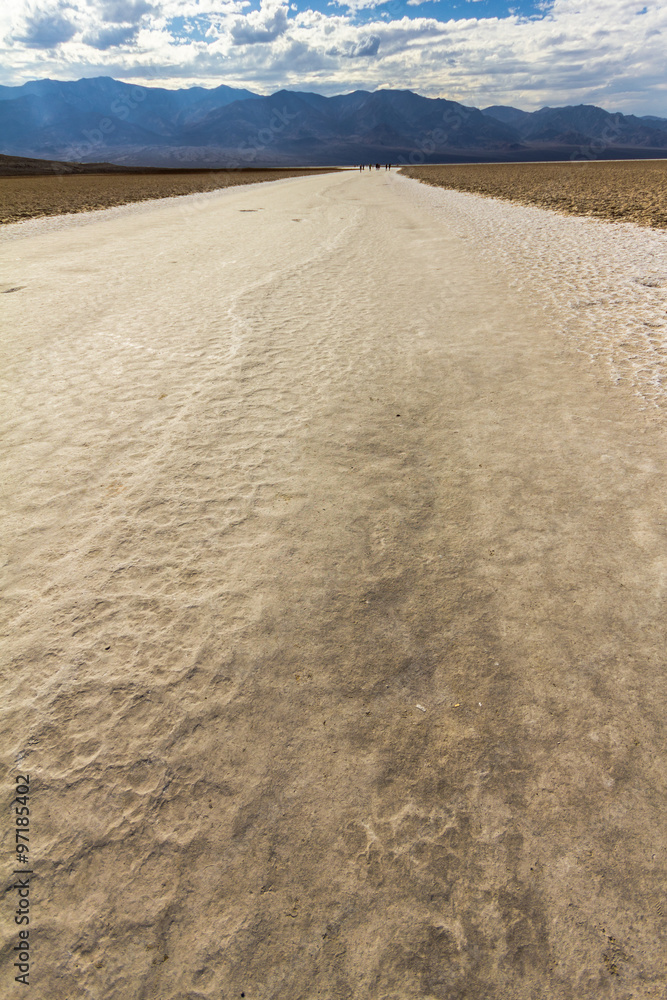 On white salt inside Death Valley at extreme heat, USA