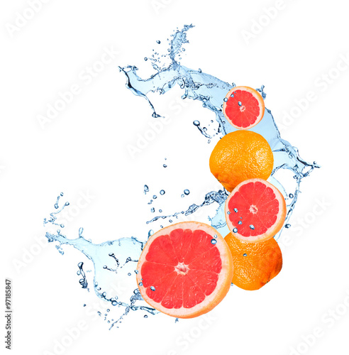 Fototapeta Naklejka Na Ścianę i Meble -  Fresh fruit in water splash, falling grapefruit
