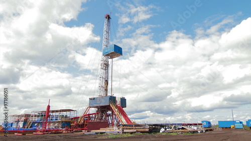 4K Timelapse clouds over drilling rig