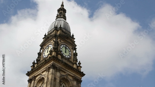 The clock tower of Bolton town hall, Lancashire, in  the half-minute leading up to 12 o'clock, noon: real time, no audio.
