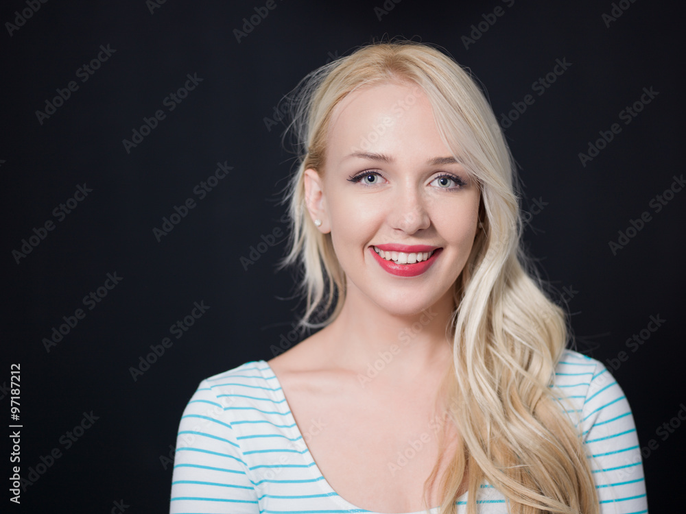 Portrait of a smiling woman on black background. Close-up. Portrait of a smiling woman on black background. Close-up.