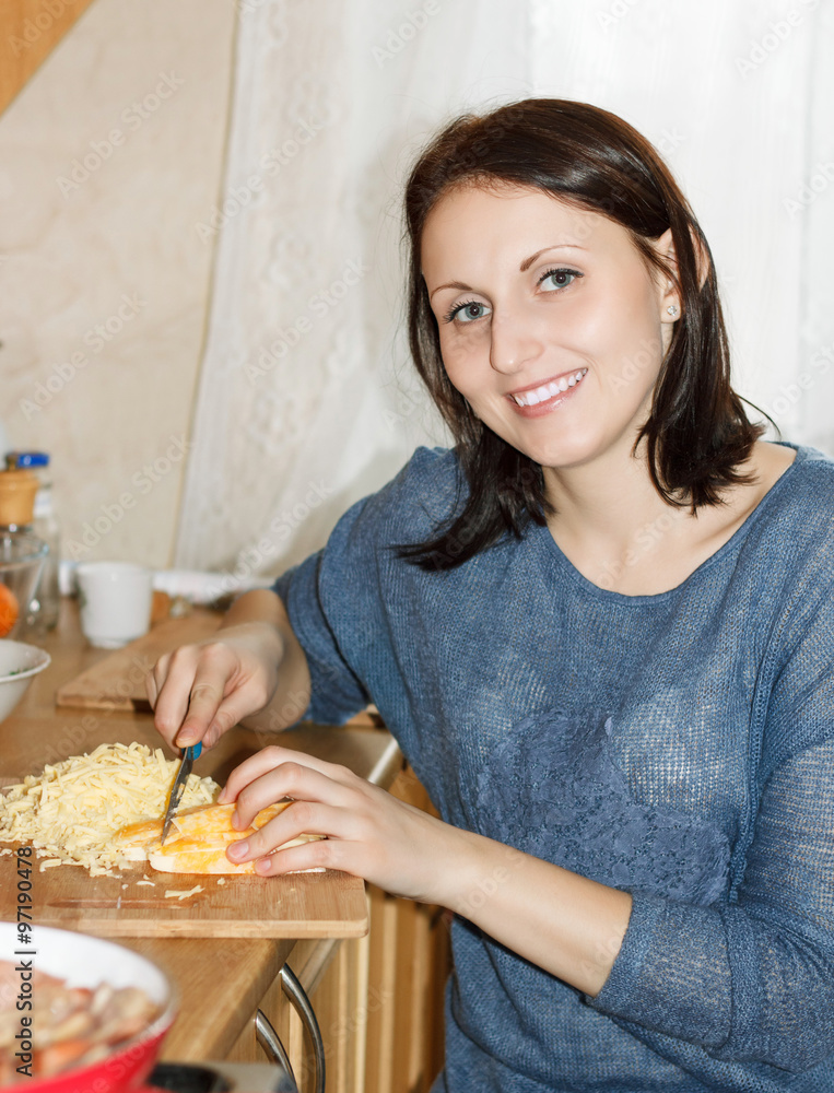 Food Preparation - Woman cutting cheese Food Preparation - Woman cutting cheese