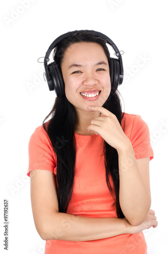 Happy asian woman is listening the song on white background