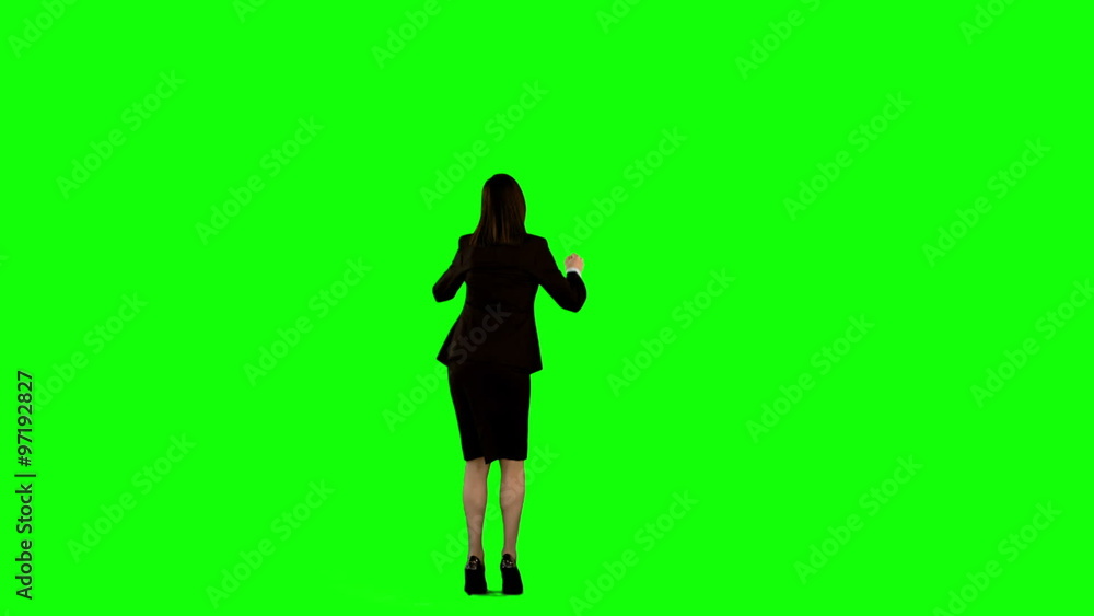 Businesswoman jumping on green screen Businesswoman jumping on green screen