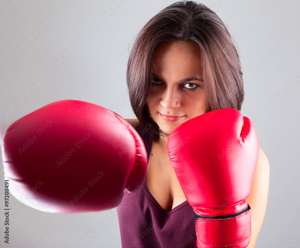sexy girl woman athlet in red boxing gloves kicking sexy girl woman athlet in red boxing gloves kicking