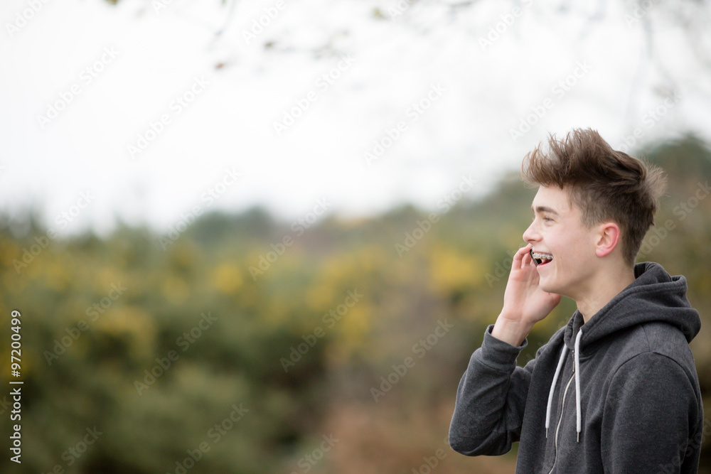 Teenage Boy Using His Mobile Phone
