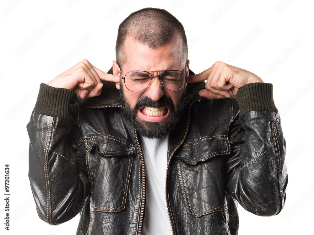 Man with leather jacket covering his ears Man with leather jacket covering his ears