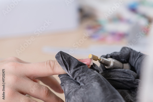 closeup of manicurist at work, Nails saloon woman nail polish re