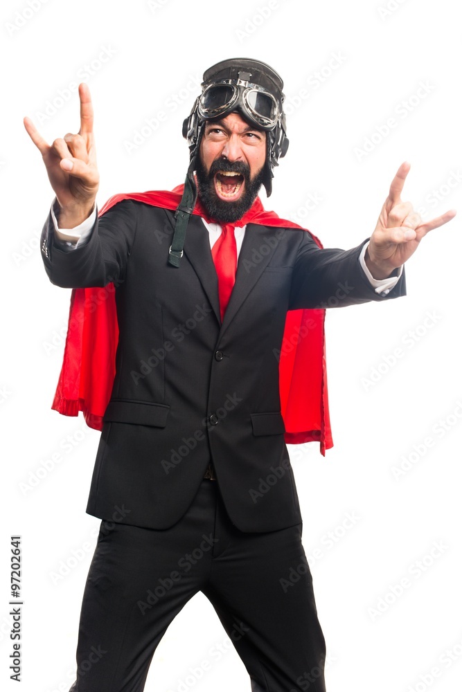 Super hero businessman making horn gesture Super hero businessman making horn gesture