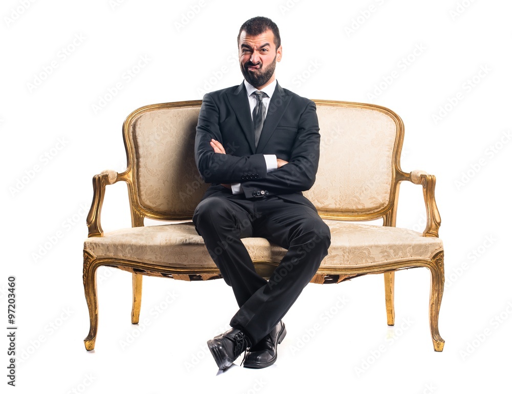 Sad Businessman sitting on armchair Sad Businessman sitting on armchair