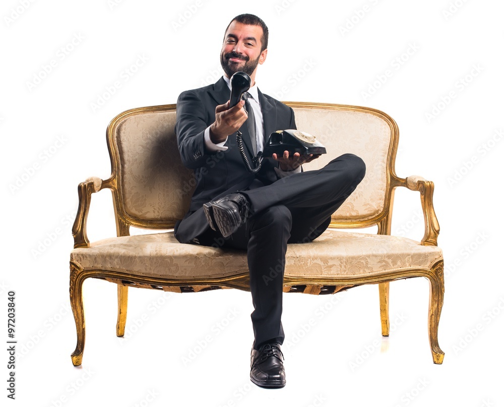 Businessman talking to vintage phone