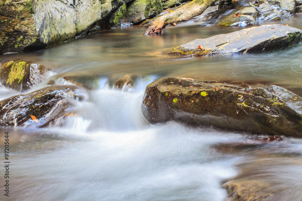 waterfall and rocks covered with moss waterfall and rocks covered with moss