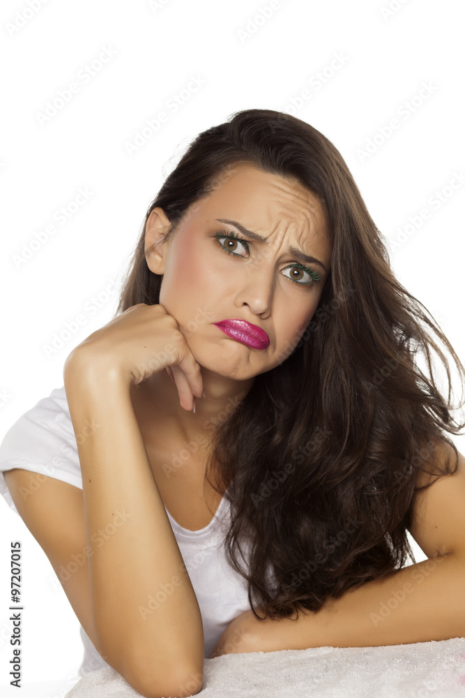pretty sad young woman with a questionable gesture pretty sad young woman with a questionable gesture