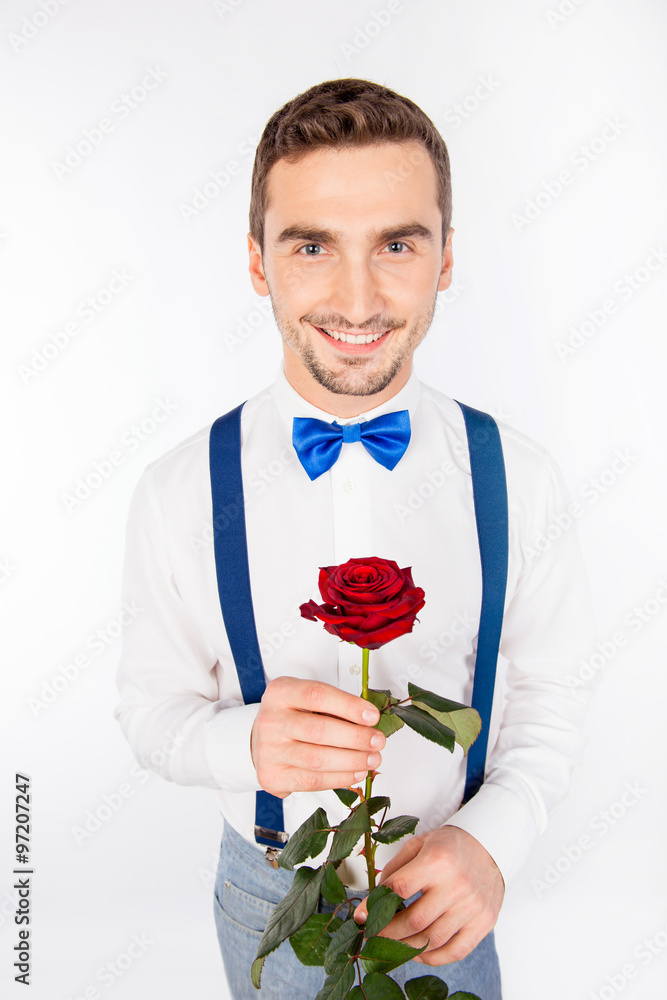 Handsome young man with nice red rose Handsome young man with nice red rose