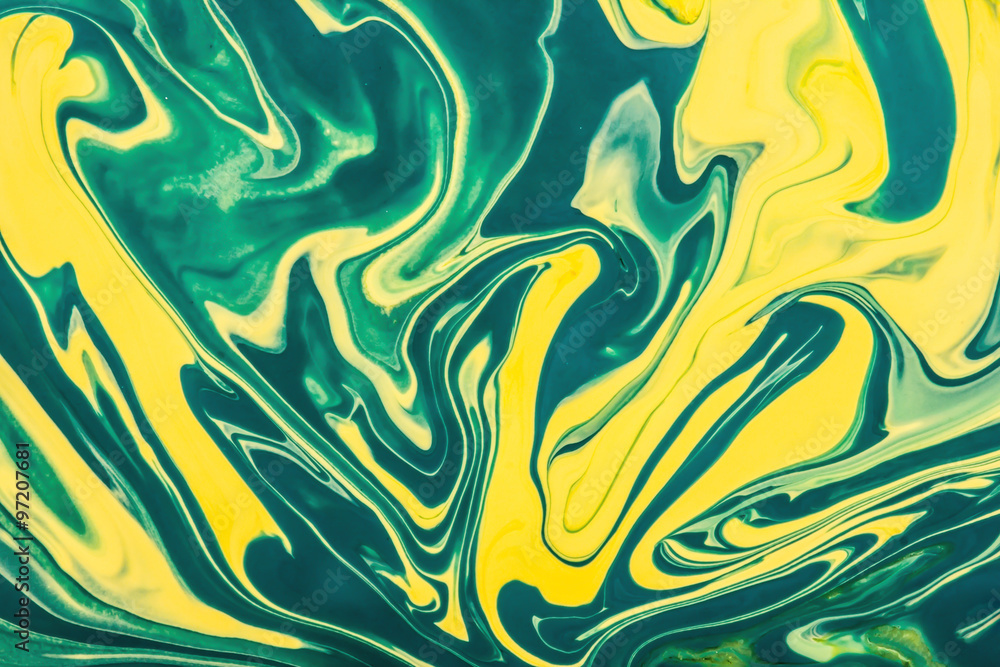 Yellow and green paint flowing and mixing texture.