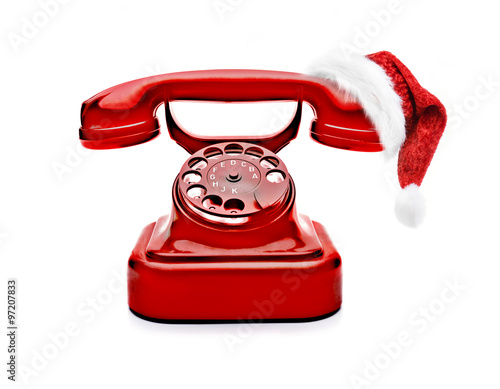 Rotes Telefon mit Weihnachtsmütze