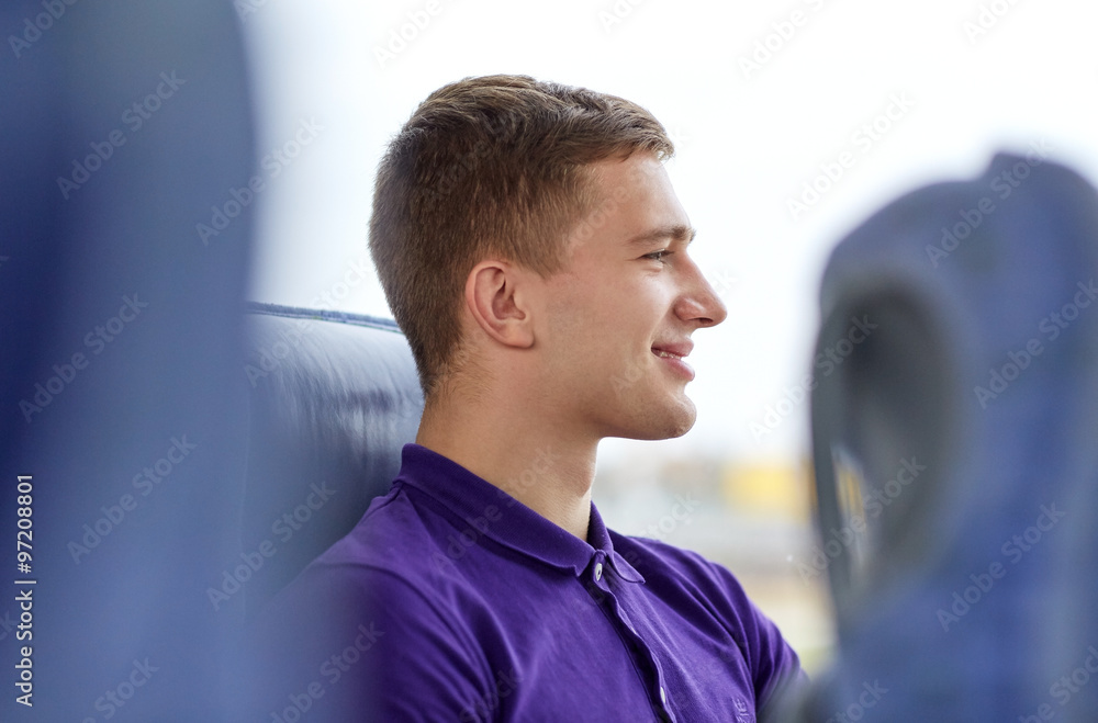 happy young man sitting in travel bus happy young man sitting in travel bus