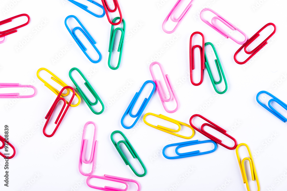 colored paper clips on a white background colored paper clips on a white background