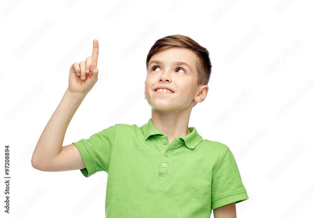 happy boy in green polo t-shirt pointing finger up happy boy in green polo t-shirt pointing finger up