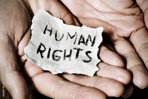 young man with a paper with the text human rights Fototapet