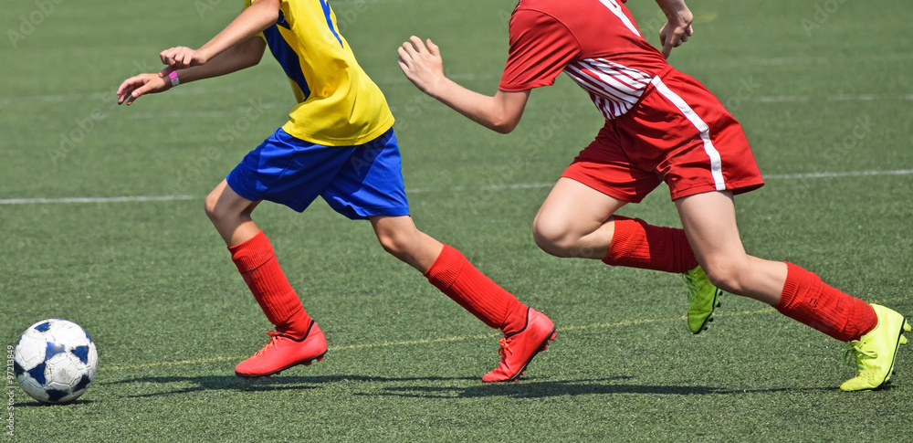 Young soccer players in action Young soccer players in action