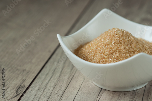 cane brown sugar in white bowl