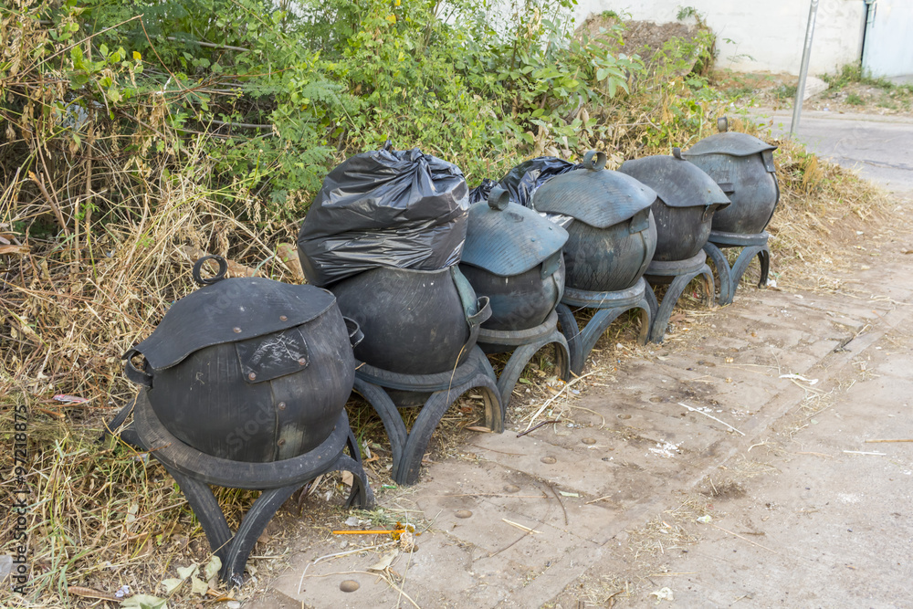 garbage bin made from old rubber tires on public road thailand