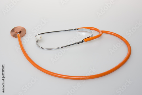 An orange Stethoscope isolated on white background