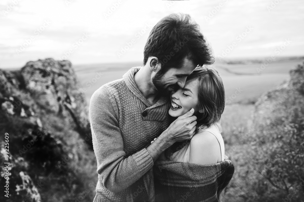 beautiful young couple on a background of rock cliff beautiful young couple on a background of rock cliff