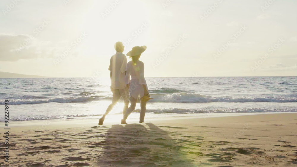 Sunset Walk on the Beach. Older Couple Holding Hands Walking Down the ...