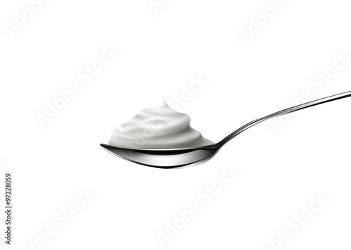 Sour cream in spoon on white background