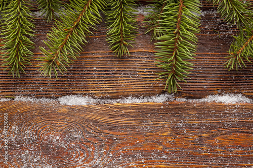 Christmas background - spruce tree on wooden wall background