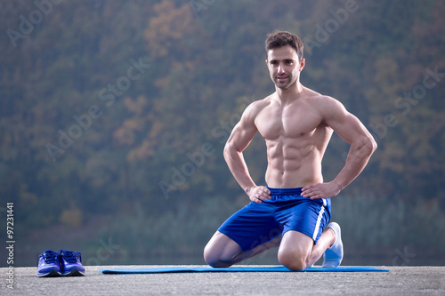 fitness man kneeling outdoor
