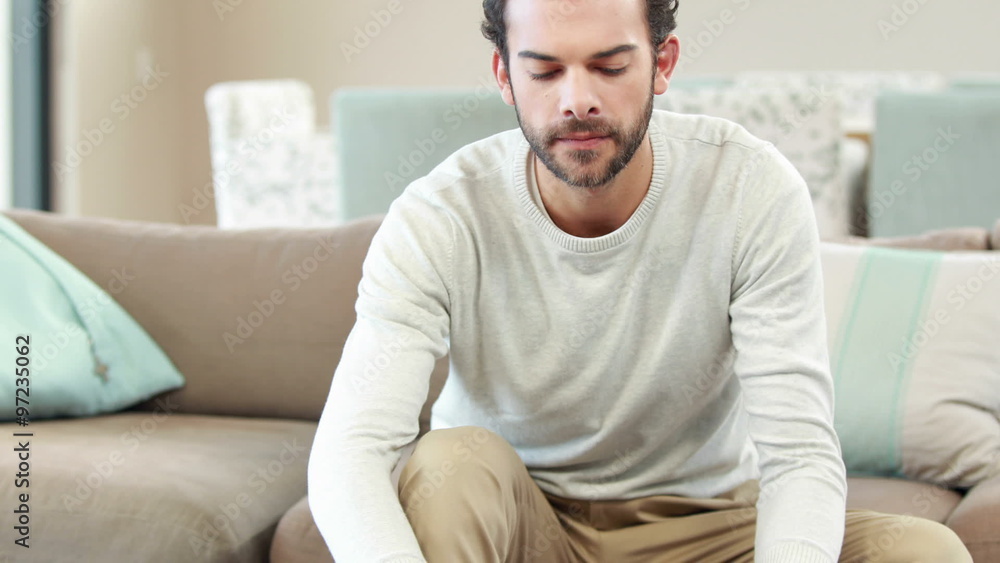 Cheerful man writing on a paper Cheerful man writing on a paper