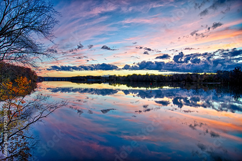 Fototapeta Naklejka Na Ścianę i Meble -  sunset and reflection with beautiful sky rainbow colors