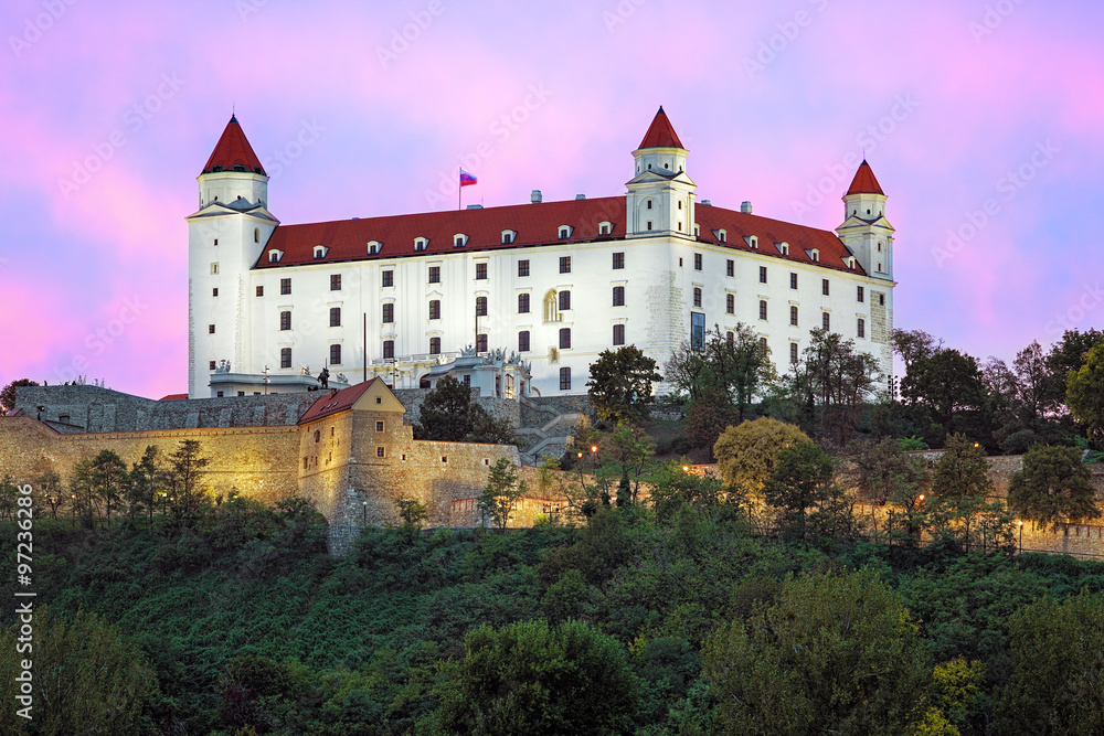 Bratislava Castle on the background of the pink clouds at sunset, Slovakia
