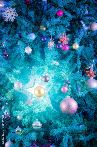Glowing blue star decoration on Christmas tree - Abstract © batke82as