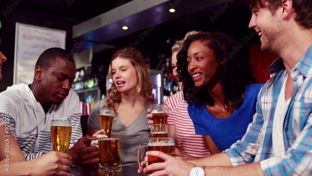 Happy friends having a drink together Happy friends having a drink together