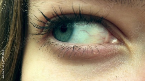 open female blue eye in 1080p a beautiful girl staring into the camera