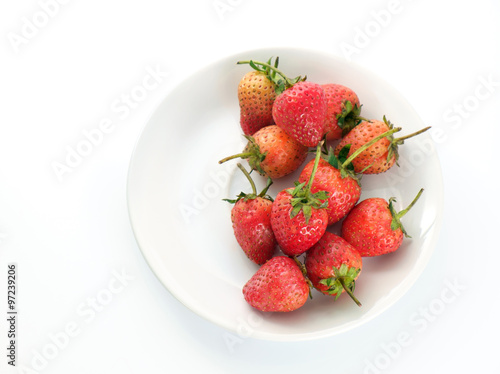 Strawberry Fresh strawberry on white dish. Top view.