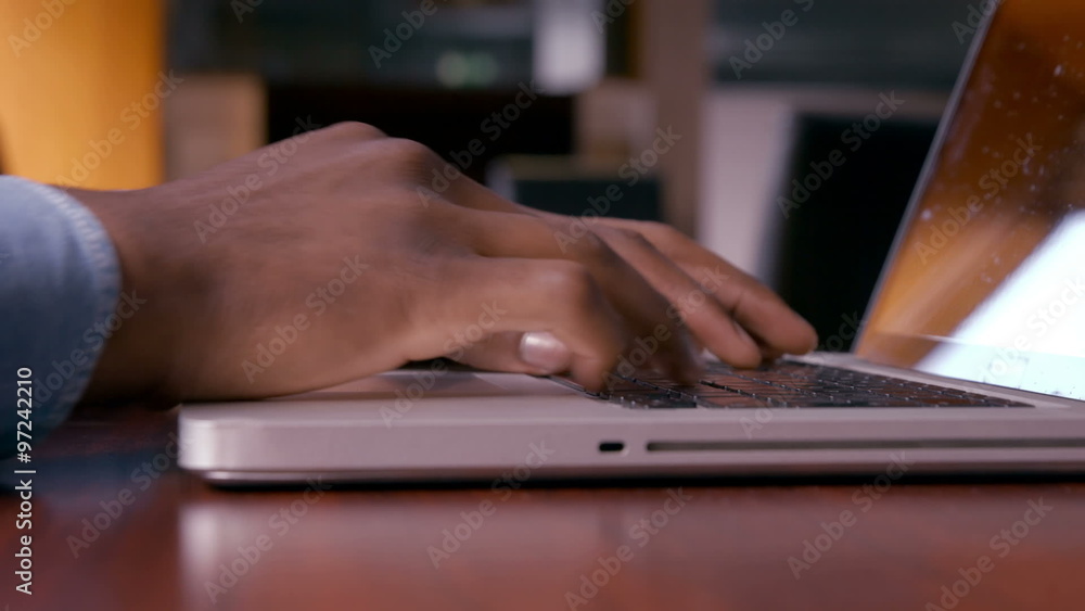 Mans hands using laptop Mans hands using laptop